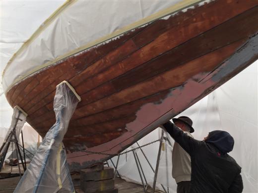 Hull down to bare wood in preparation for fairing