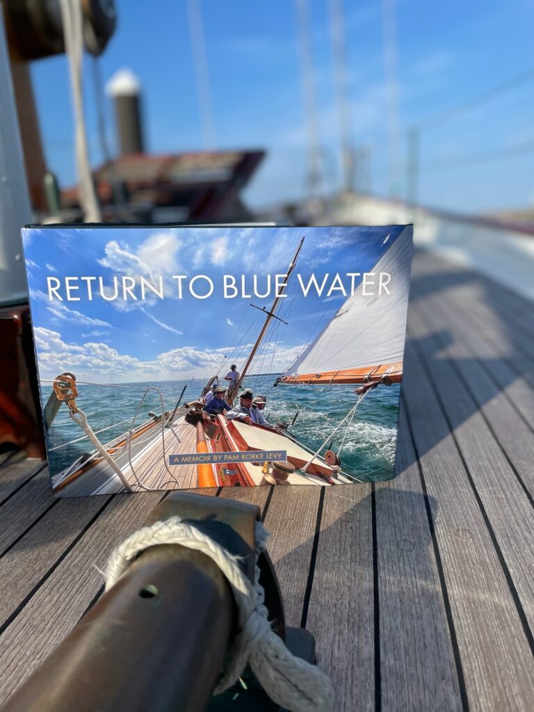 Return to Blue Water book shown on deck of Dorade